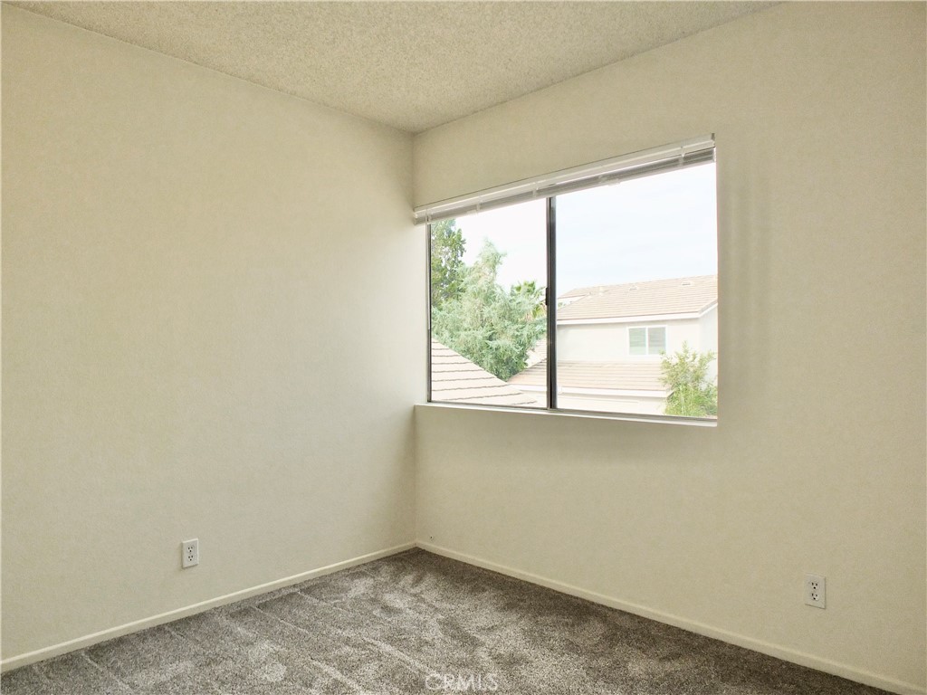 14431 Raintree Road Tustin, CA 92780 - Photo 35 of 53 an empty room with a window