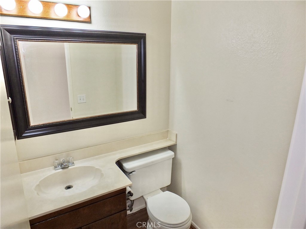 14431 Raintree Road Tustin, CA 92780 - Photo 44 of 53 a bathroom with a sink mirror and toilet