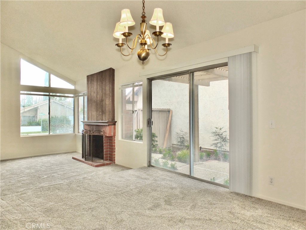 14431 Raintree Road Tustin, CA 92780 - Photo 5 of 53 a view of an empty room with a window