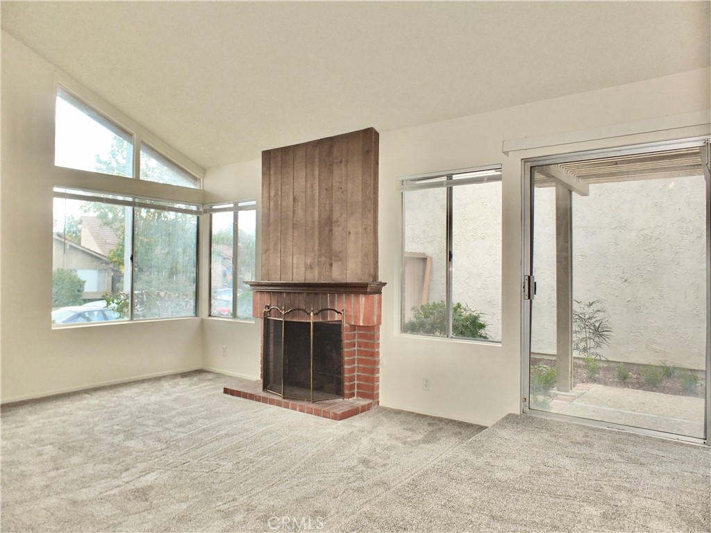 14431 Raintree Road Tustin, CA 92780 - Photo 7 of 53 an empty room with windows