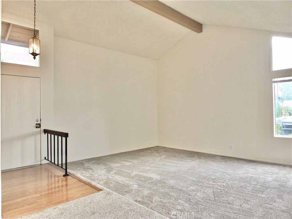 14431 Raintree Road Tustin, CA 92780 - Photo 10 of 53 an empty room with windows & wooden floor