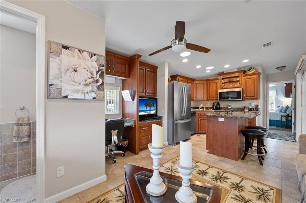 1515 Ruby Lake Point Naples, FL 34114 - Photo 16 of 21 a view of a dining room with furniture
