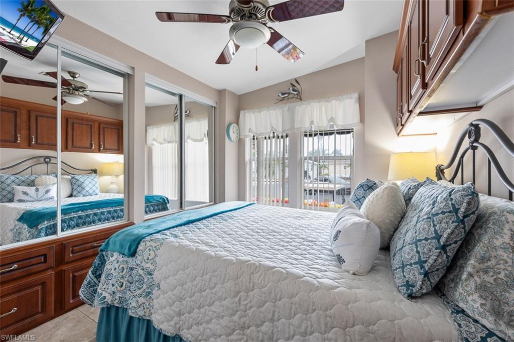 1515 Ruby Lake Point Naples, FL 34114 - Photo 20 of 21 a bed sitting in a bedroom next to a window