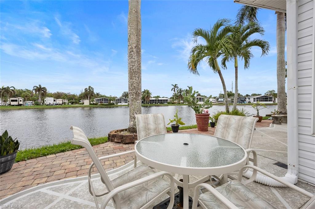 1515 Ruby Lake Point Naples, FL 34114 - Photo 21 of 21 a ocean view with a table and chairs