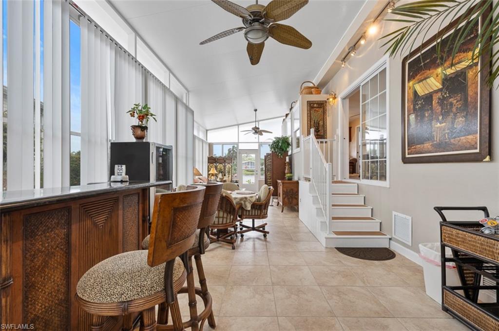 1515 Ruby Lake Point Naples, FL 34114 - Photo 6 of 21 a view of a dining room with furniture and a window