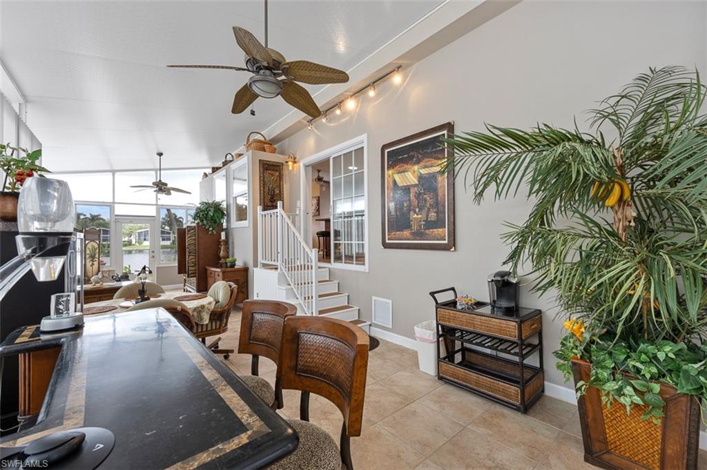 1515 Ruby Lake Point Naples, FL 34114 - Photo 7 of 21 a view of a livingroom with furniture and a potted plant