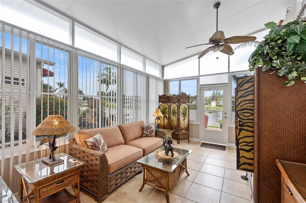 1515 Ruby Lake Point Naples, FL 34114 - Photo 10 of 21 a living room with furniture a lamp and a potted plant