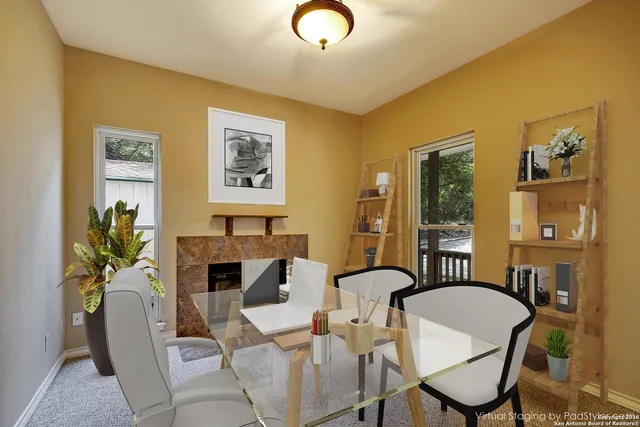 a dining room with furniture and window