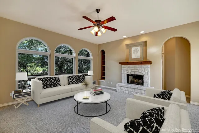 a living room with furniture and a large window