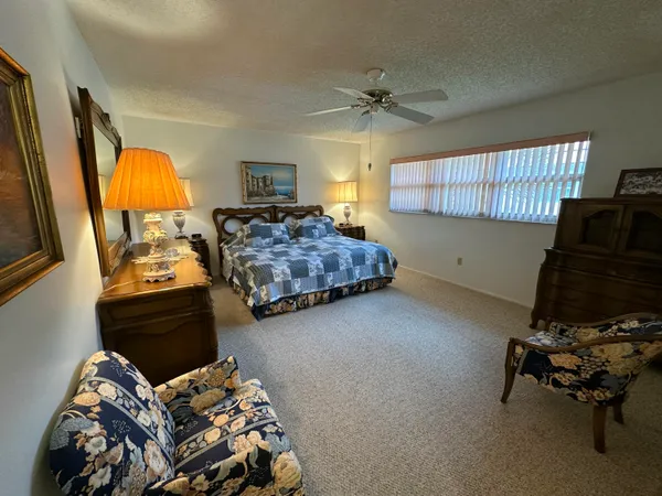 a bedroom with bed and a window