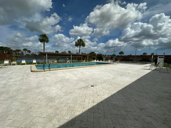 a view of swimming pool with a yard