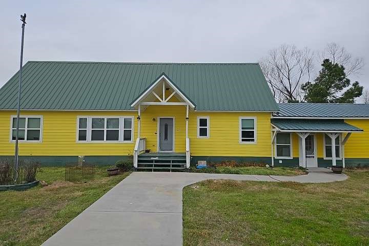 2 Birdwell Road Bedias, TX 77831 - Photo 1 of 11 a front view of a house with a yard