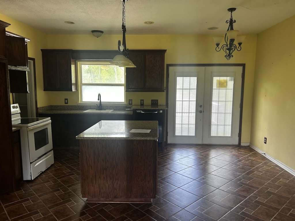 2 Birdwell Road Bedias, TX 77831 - Photo 4 of 13 a kitchen with a sink appliances and cabinets