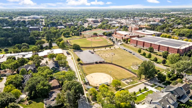 a view of swimming pool with a yard and plants