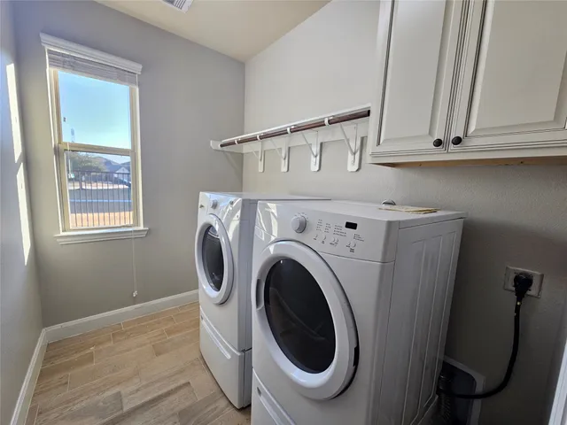 a utility room with dryer and washer