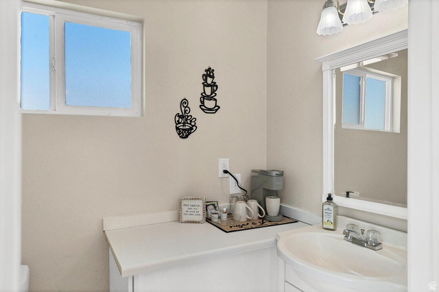 2990 East Riverside Drive, Unit 173 St. George, UT 84790 - Photo 23 of 38 White vanity with a built-in sink and chrome faucet