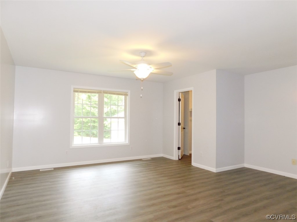 2317 Meherrin Road Meherrin, VA 23954 - Photo 17 of 28 an empty room with wooden floor and window