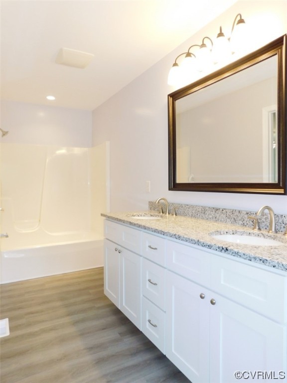2317 Meherrin Road Meherrin, VA 23954 - Photo 19 of 28 a bathroom with a granite countertop sink and a mirror