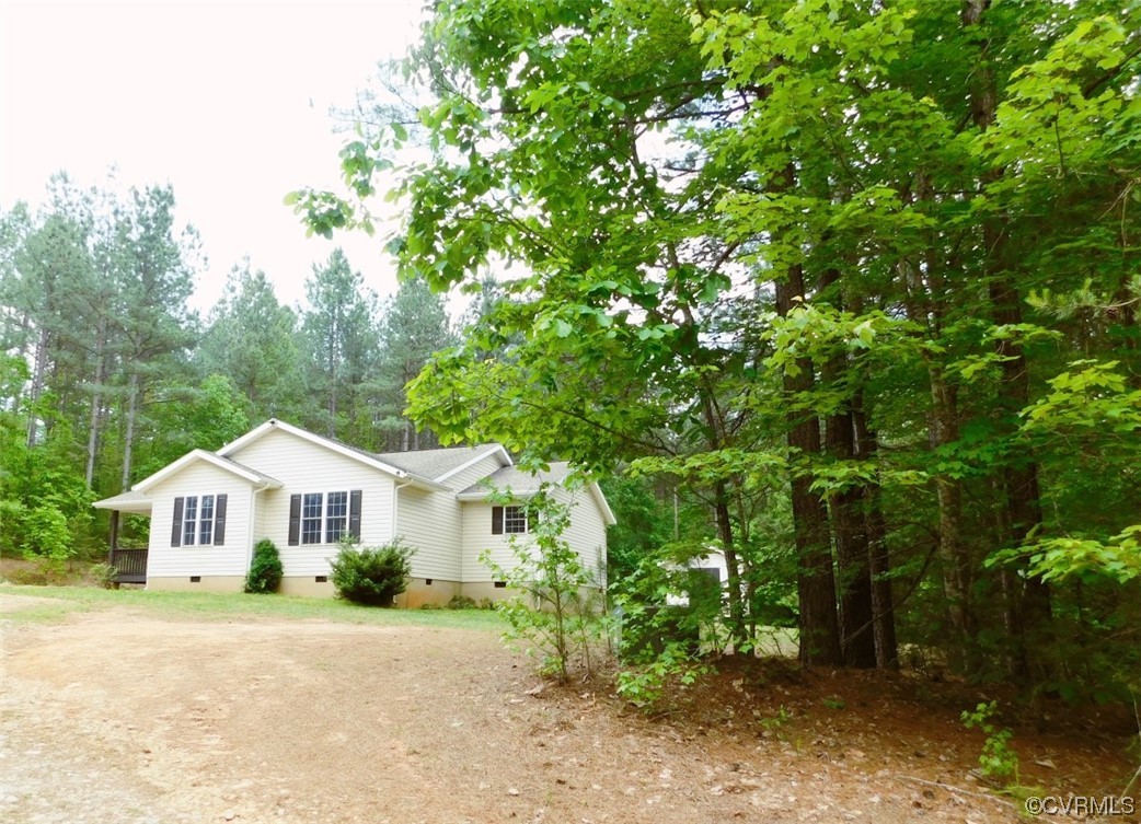 2317 Meherrin Road Meherrin, VA 23954 - Photo 3 of 28 a front view of a house with a yard and garage
