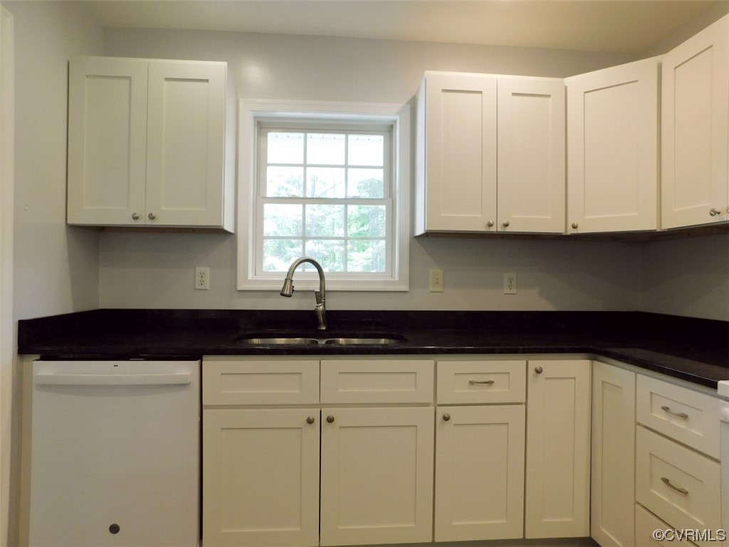 2317 Meherrin Road Meherrin, VA 23954 - Photo 8 of 28 a kitchen with white cabinets and a sink