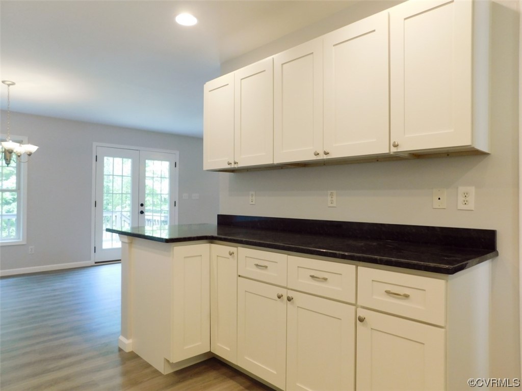 2317 Meherrin Road Meherrin, VA 23954 - Photo 9 of 28 a kitchen with granite countertop white cabinets and a sink