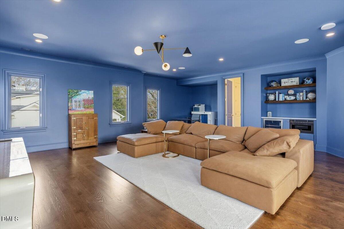 2123 St Marys Street Raleigh, NC 27608 - Photo 41 of 77 a living room with fireplace furniture and a wooden floor