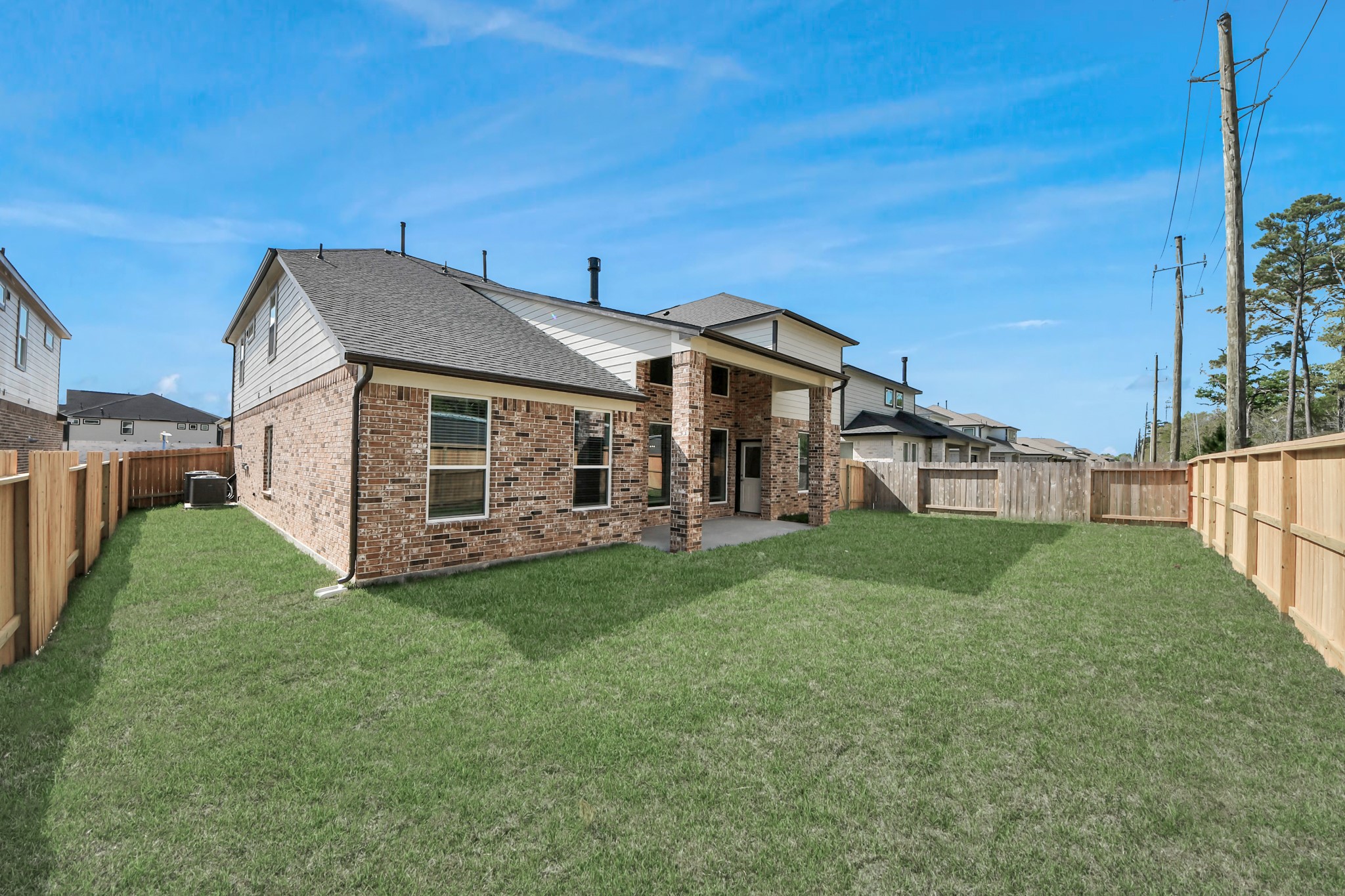 3023 Native Spg Drive Spring, TX 77373 - Photo 46 of 50 Backyard retreat, offering an abundance of space for kids to play and explore. The possibilities are endless in this outdoor haven, where the joy of open-air activities and family gatherings awaits.