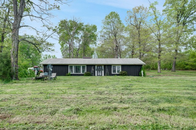 4012 Sango Road Clarksville, TN 37043 - Photo 4 of 22 a view of a house with a backyard