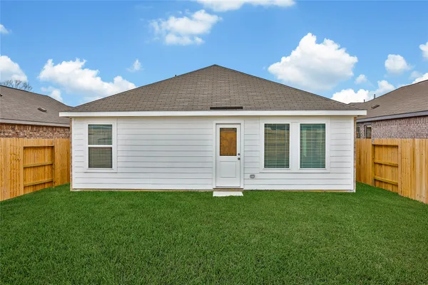 a front view of house with yard and front view
