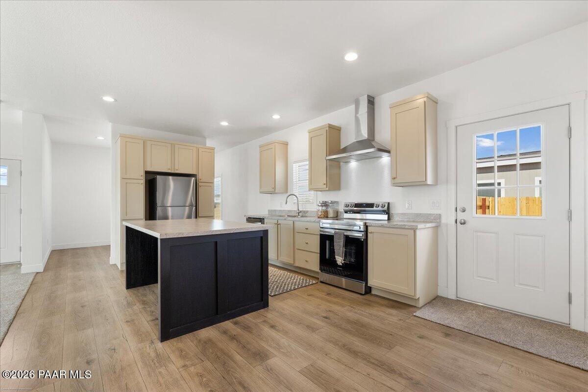 65 Hawaii Road Paulden, AZ 86334 - Photo 7 of 29 a kitchen with cabinets and wooden floor