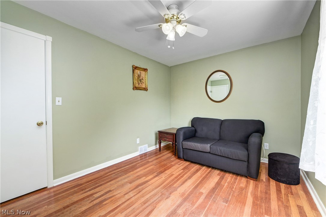 21399 Mastick Road Cleveland, OH 44126 - Photo 36 of 47 Living area featuring ceiling fan and light wood-type flooring