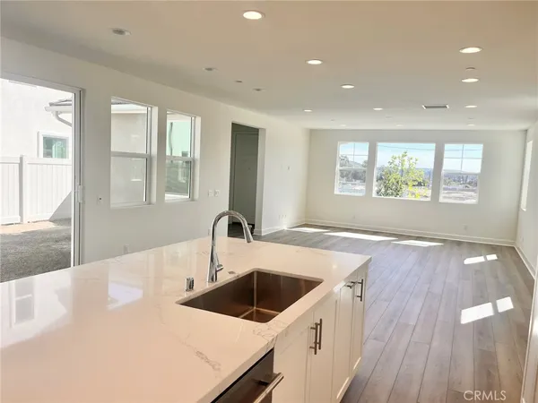 a kitchen with a sink a counter top space and appliances
