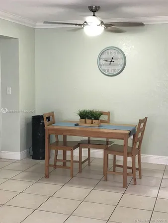 a view of a dining room with furniture and a table