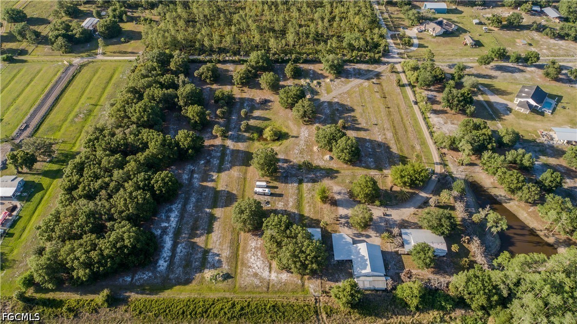 3880 Packinghouse Road Alva, FL 33920 - Photo 8 of 29 an aerial view of residential houses with outdoor space