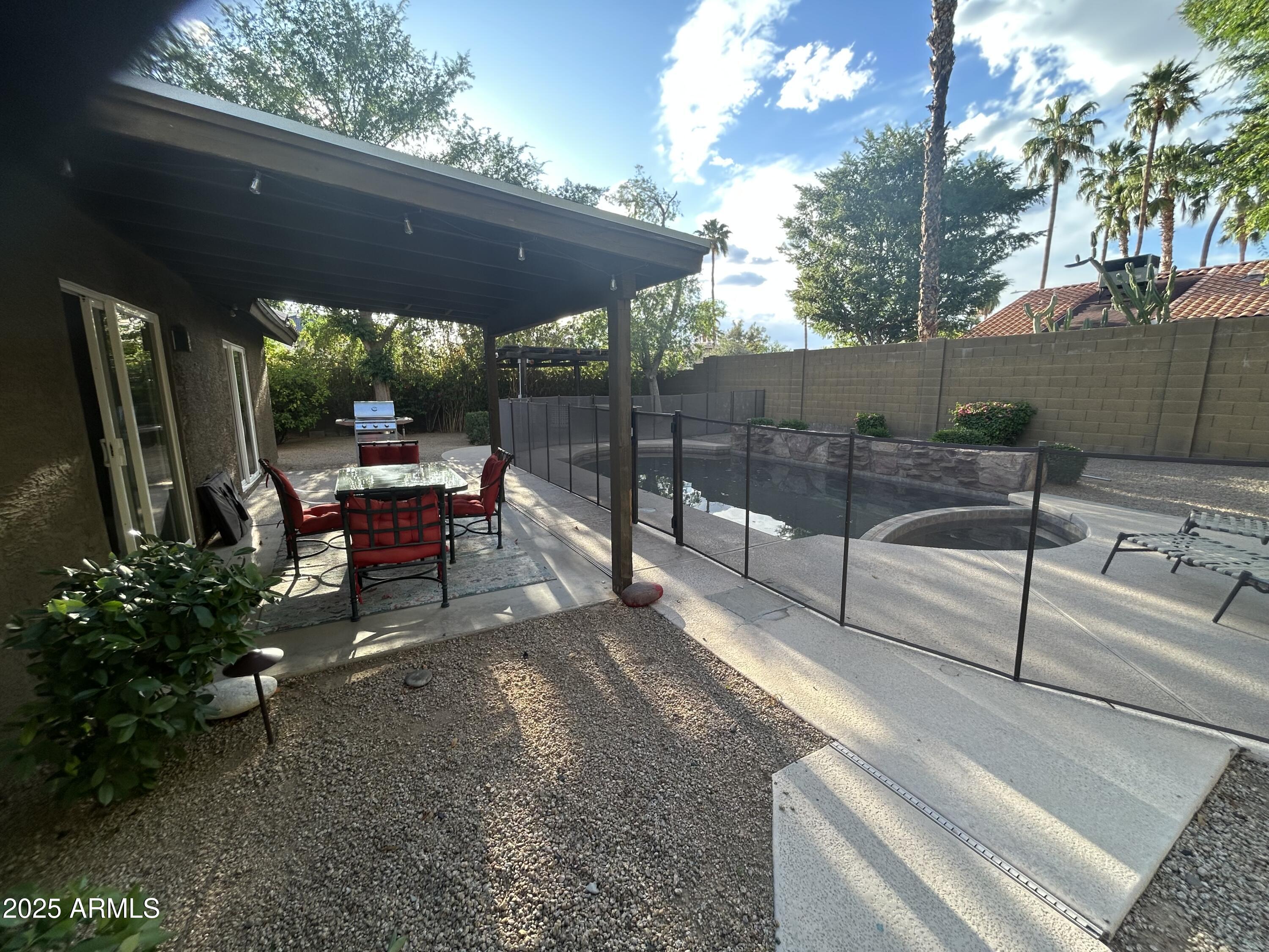 6002 East Beck Lane Scottsdale, AZ 85254 - Photo 27 of 35 a view of a backyard with sitting area