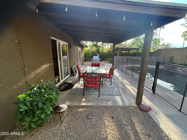 a view of a swimming pool with a patio
