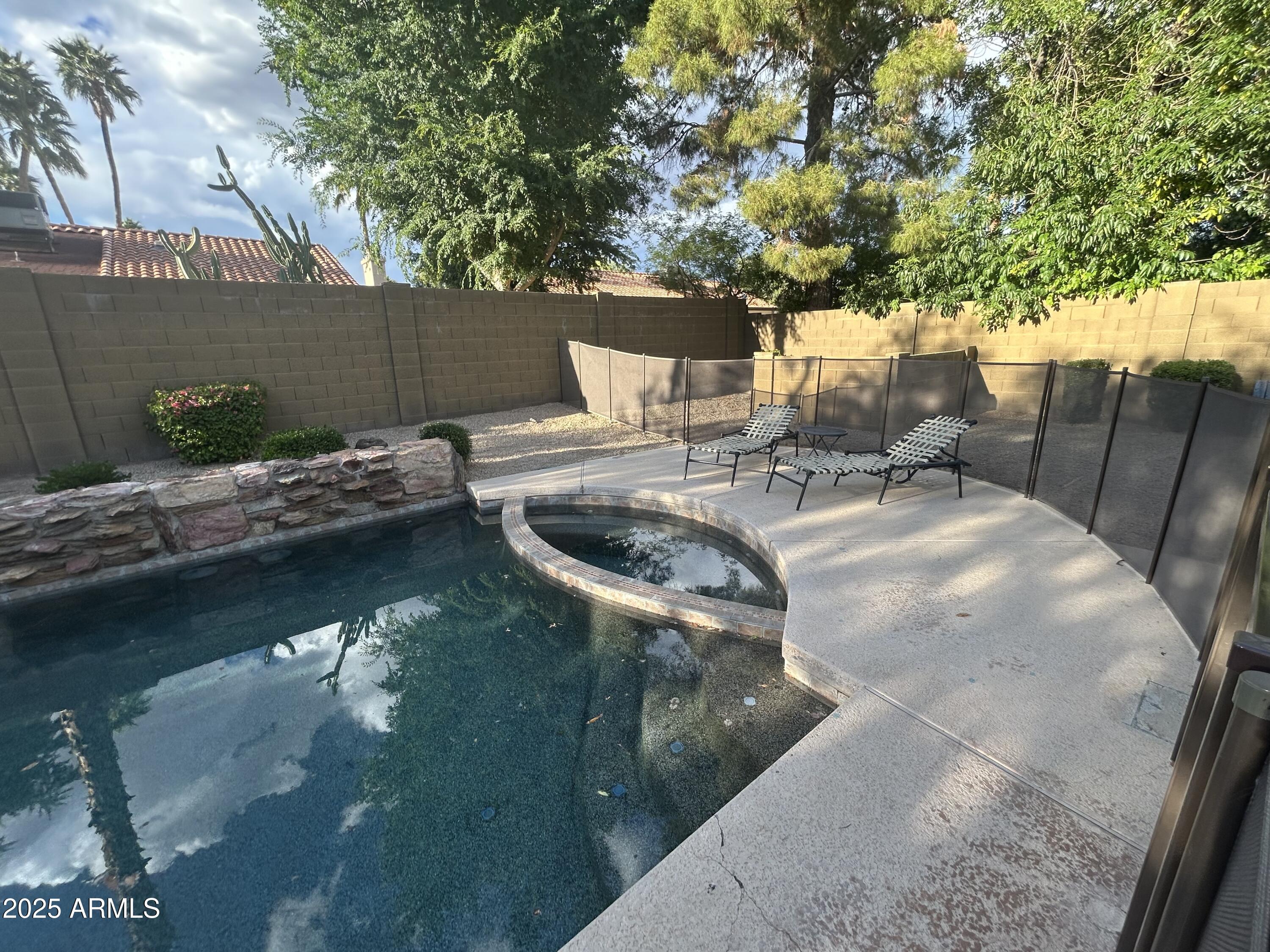 6002 East Beck Lane Scottsdale, AZ 85254 - Photo 29 of 35 a view of a swimming pool with a patio
