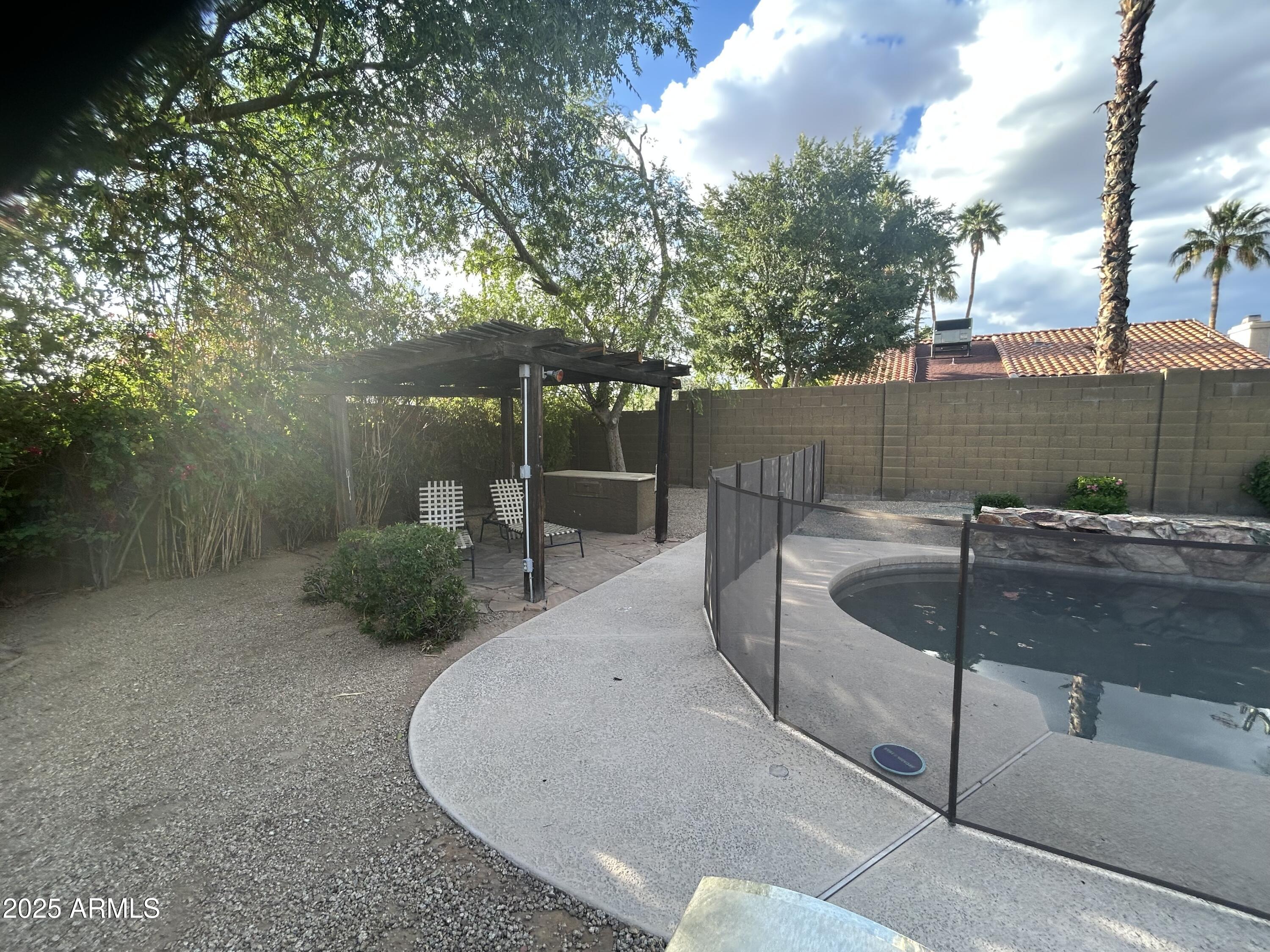 6002 East Beck Lane Scottsdale, AZ 85254 - Photo 31 of 35 a view of a swimming pool with a patio