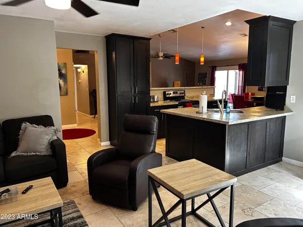 a kitchen with a table chairs and a refrigerator