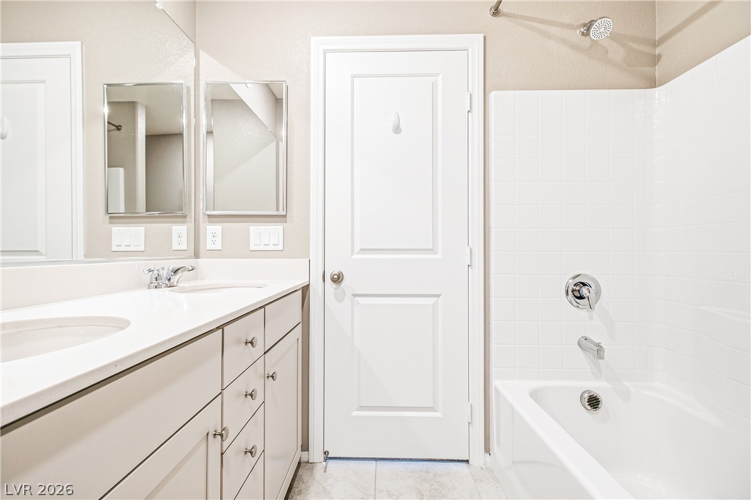 2834 Turnstone Ridge Street Henderson, NV 89044 - Photo 16 of 22 Clean lines and a spacious double vanity define this functional bathroom layout.