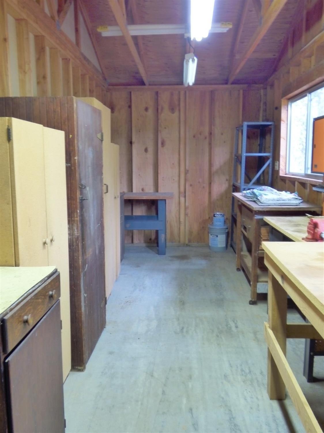 801 Hummingbird Road Cave Junction, OR 97523 - Photo 17 of 31 Small workshop room within garage.