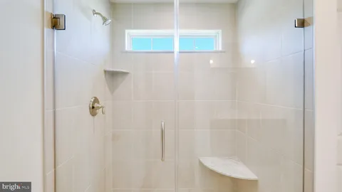 a bathroom with a double vanity sink and mirror