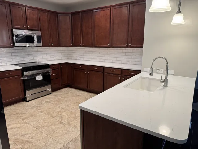a kitchen with a sink and cabinets