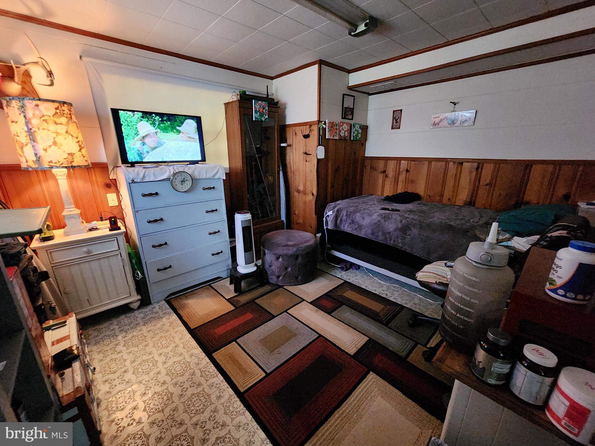 761 Wertzville Road Enola, PA 17025 - Photo 17 of 25 a bedroom with furniture and a flat screen tv