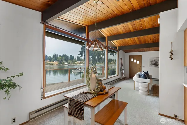 a room with furniture and large windows