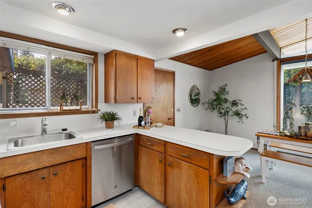 a kitchen with a sink and large window