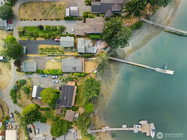 an aerial view of a houses with outdoor space