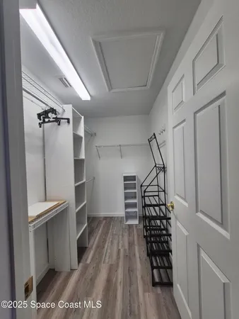 a view of entryway with wooden floor