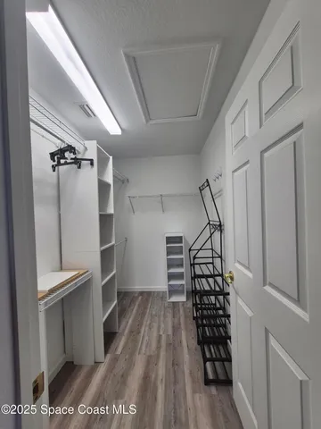 a view of entryway with wooden floor