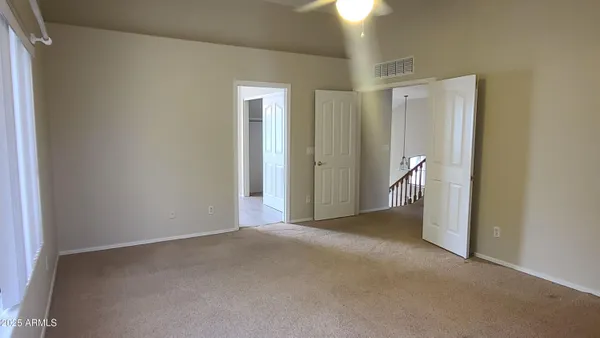 a bathroom with a tub shower and sink